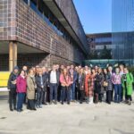 Group photo outside in front of the building.