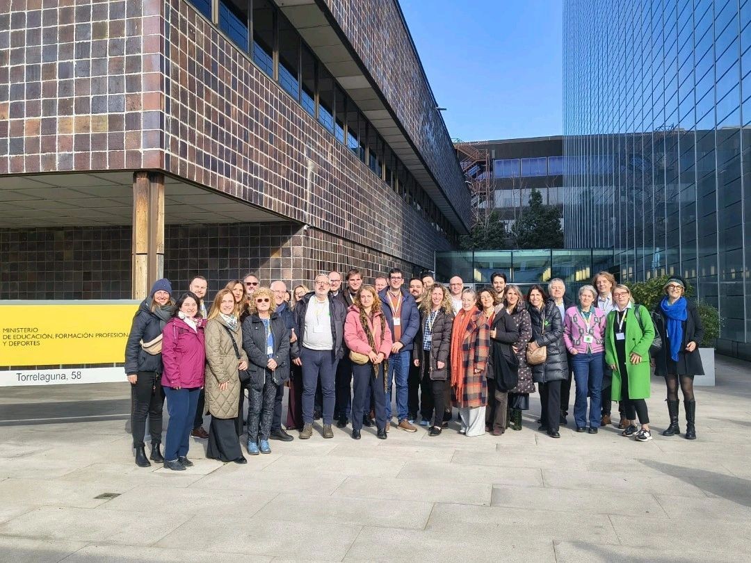 Group photo outside in front of the building.